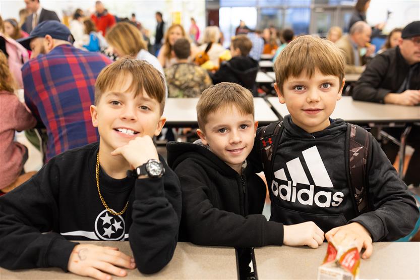 Students and their families enjoy donuts